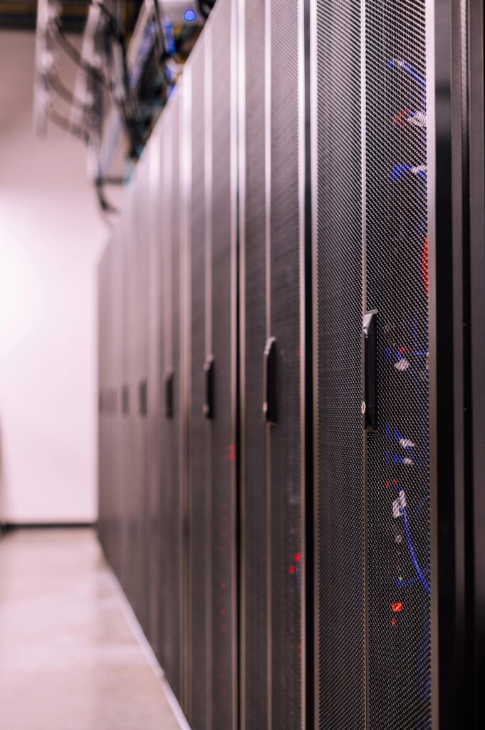 Detailed view of network server racks in a modern data center, highlighting technology infrastructure.